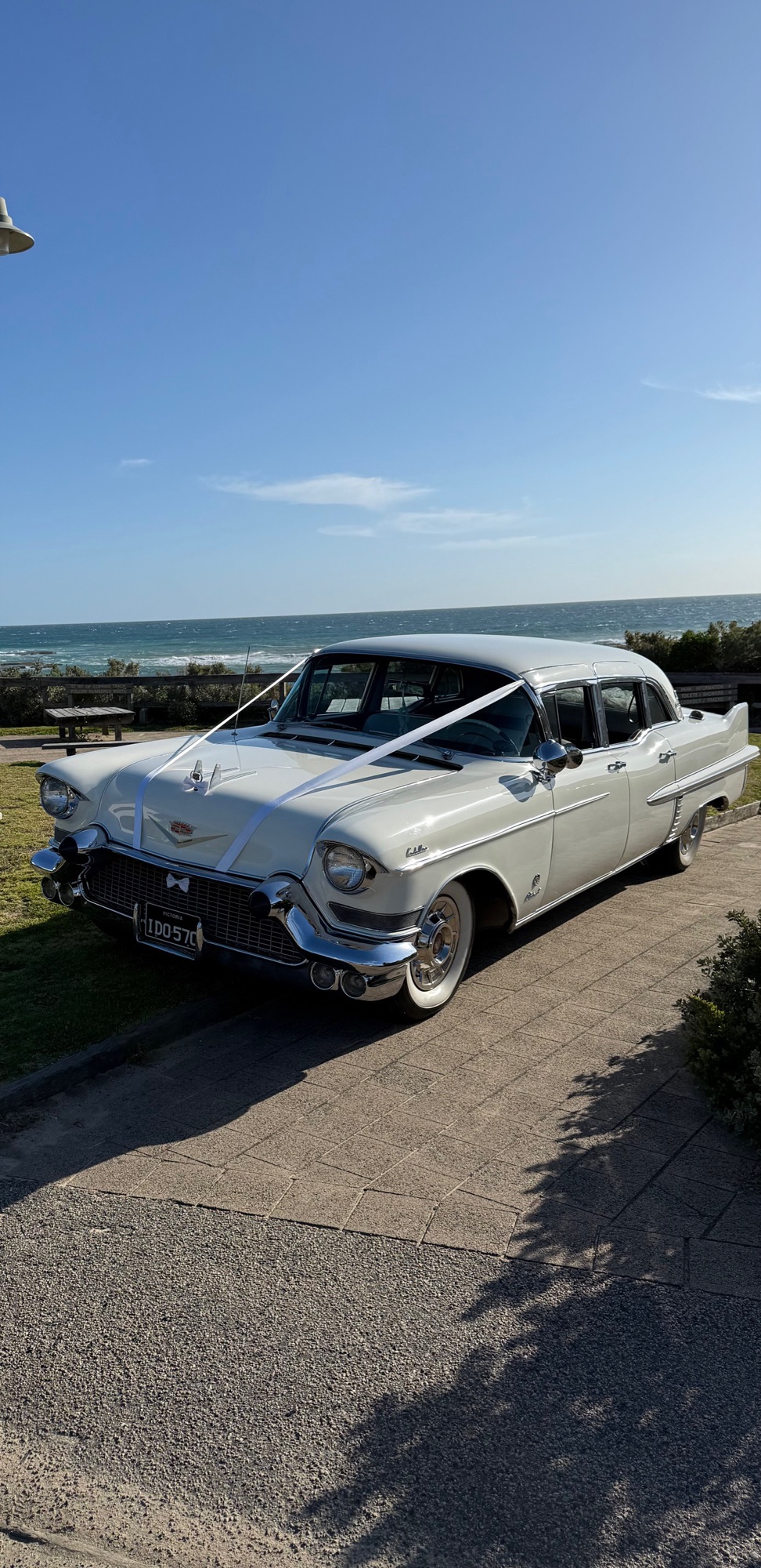 The Dutchess, Caddyman's white 1957 Cadillac Series 75 wedding limousine, parked by the coast near Melbourne