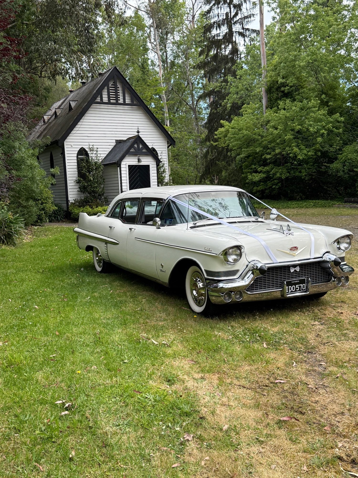 The Dutchess, Caddyman's white Cadillac wedding limousine, parked on a country estate driveway near Melbourne