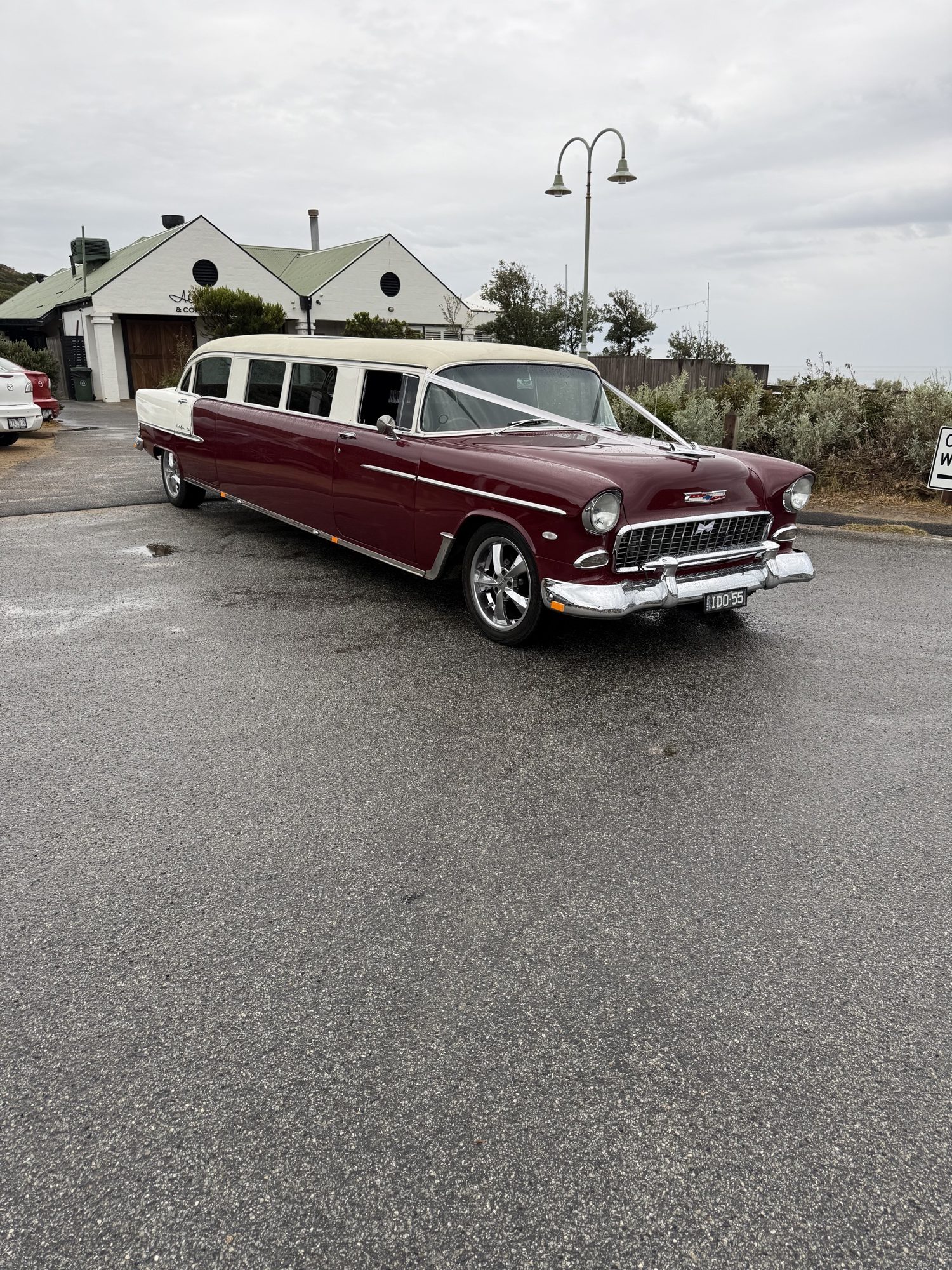 The Prince, Caddyman's maroon Bel Air wedding car, parked roadside near Melbourne
