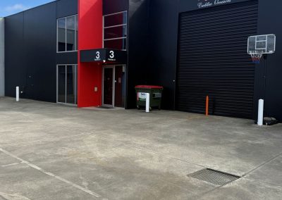 Front of the Caddyman showroom at 2/3 Duiker Court, Langwarrin, black building with red feature panel and Caddyman signage