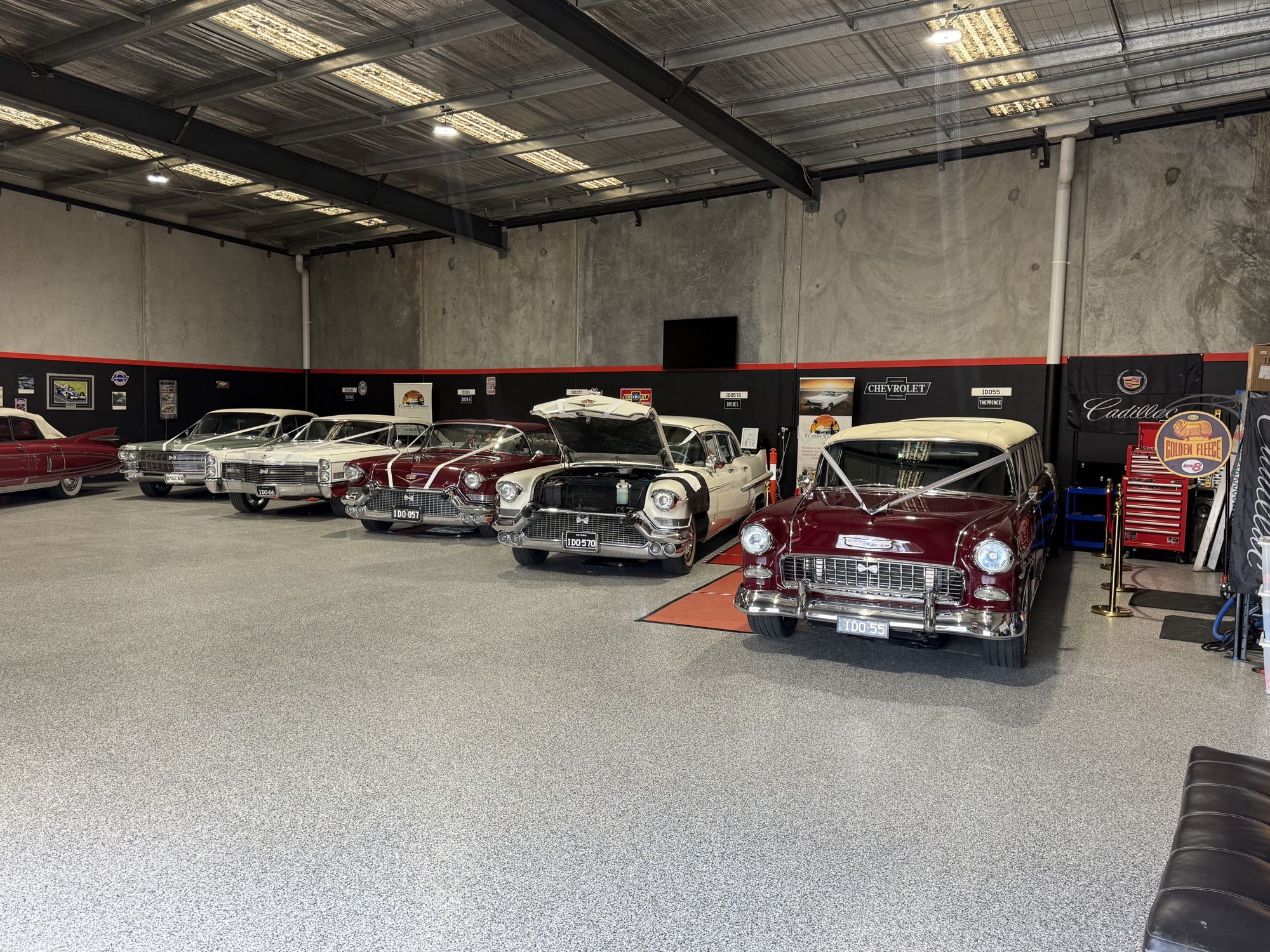 The Caddyman fleet lined up inside the showroom at 2/3 Duiker Court, Langwarrin