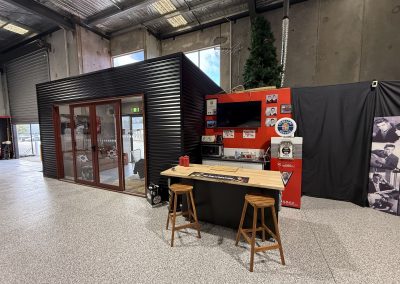 Lounge and bar area inside the Caddyman showroom at 2/3 Duiker Court, Langwarrin