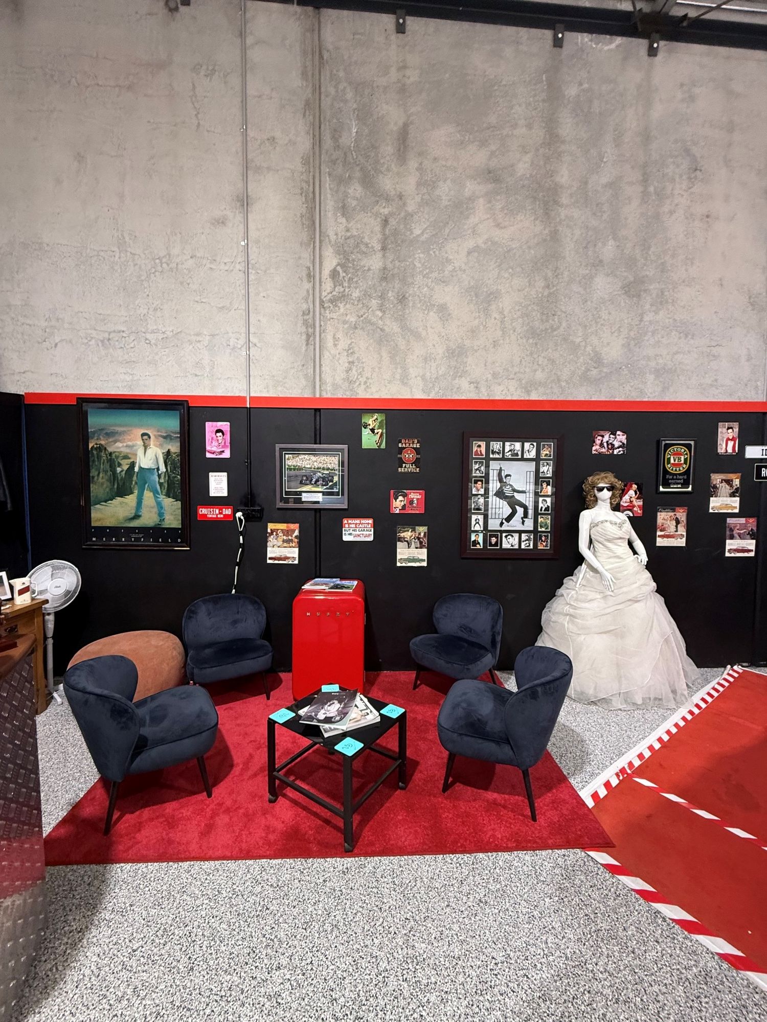 Lounge corner with wedding dress display inside the Caddyman showroom at 2/3 Duiker Court, Langwarrin