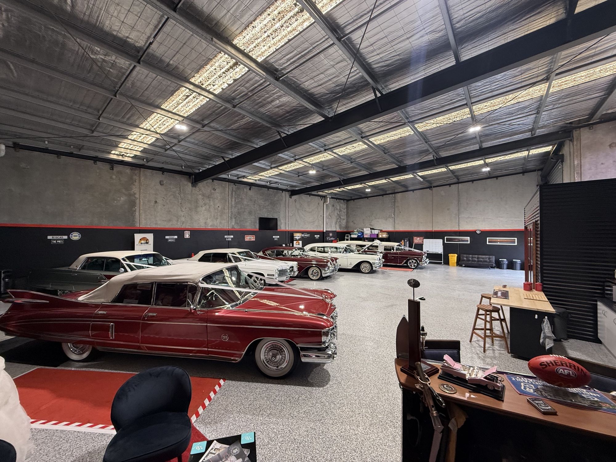 Rosie and the rest of the fleet inside the Caddyman showroom at 2/3 Duiker Court, Langwarrin