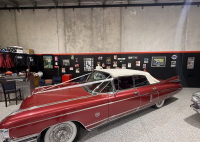 Side view of Rosie, the pink 1959 Cadillac convertible, inside the Caddyman showroom at 2/3 Duiker Court, Langwarrin